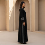 represent Black Traditional Thobe with White Geometric Woven