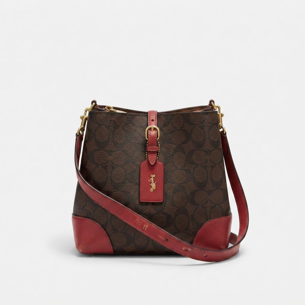 COACH LEATHERWARE Monogram Bucket Crossbody Bag with Red Tri