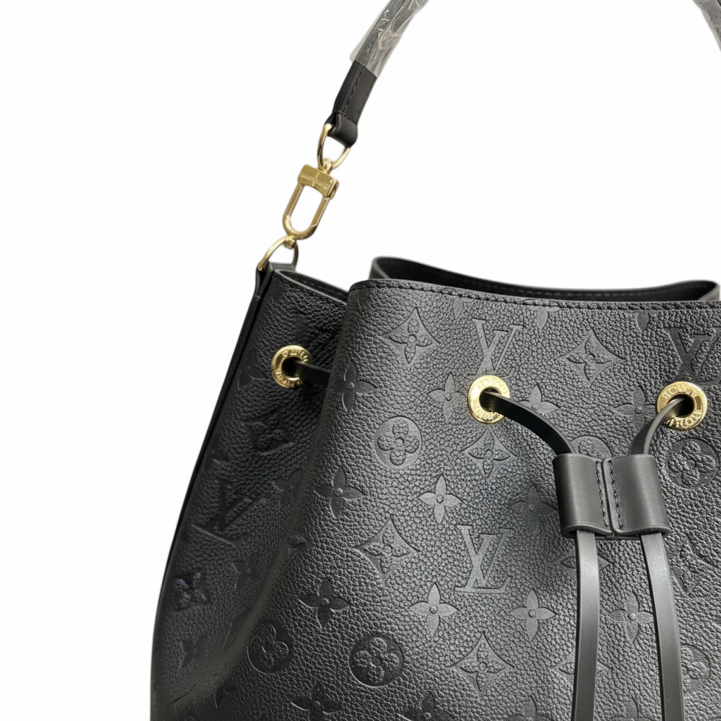 LOUIS VUITTON Women's Black Embossed Drawstring Bucket Bag