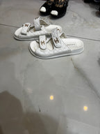 CHANEL White Quilted Double-Strap Flat Sandals with Gold Log