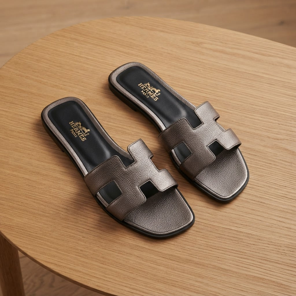HERMES Gunmetal Metallic Flat Slides with H-Cutout Detail