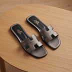 HERMES Gunmetal Metallic Flat Slides with H-Cutout Detail