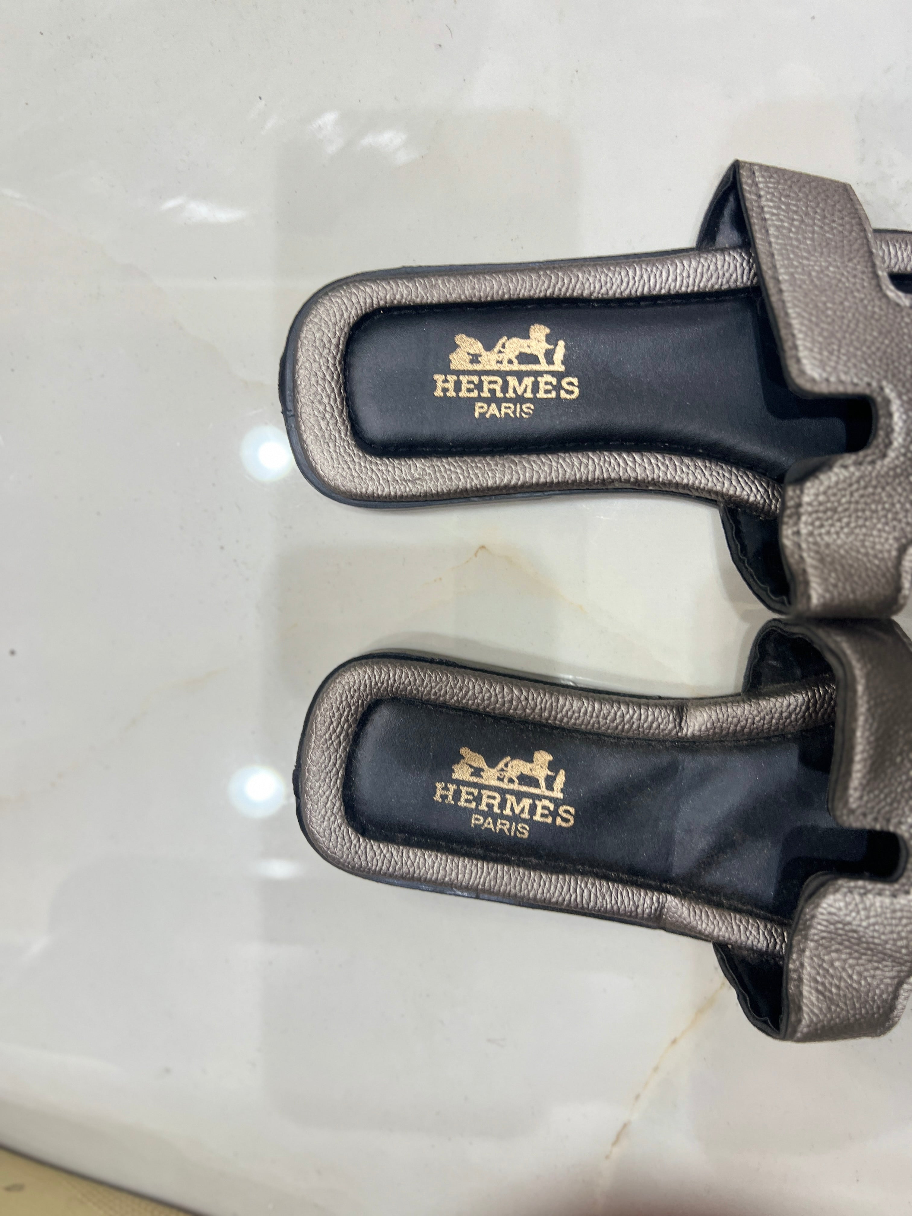 HERMES Gunmetal Metallic Flat Slides with H-Cutout Detail