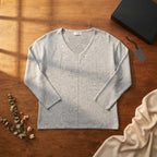 [WearU Generated:merch_flat_lay] Grey Heathered Knit Jersey Boxy V-Neck Top – flat lay view