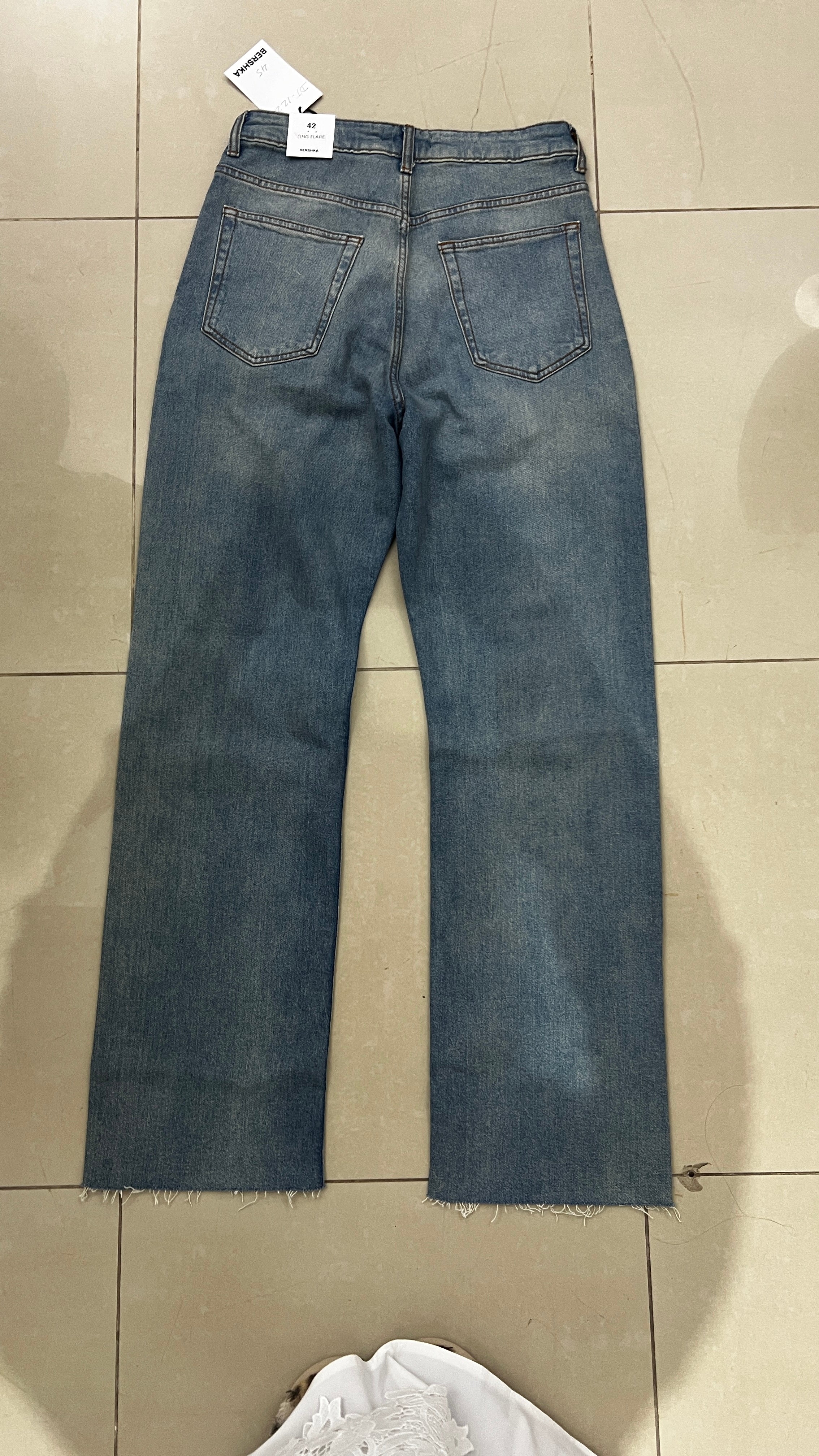 BERSHKA Mid-Blue High-Rise Long Flare Jeans with Raw Hem
