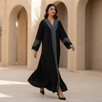 represent Black Traditional Thobe with White Geometric Woven